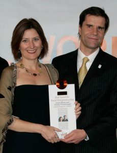 Susan Burns and Mathis Wackernagel receiving Skoll award